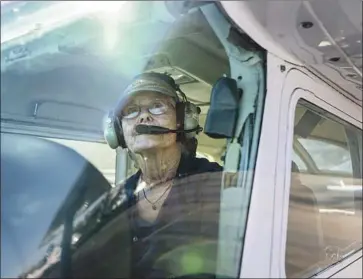  ?? Ariana Drehsler For the San Diego Union-Tribune ?? ANN ROTHWELL prepares to fly a Cessna 172 this month at San Diego’s Montgomery-Gibbs Executive Airport. After a battle with cancer, the 75-year-old completed her first solo flight in five years on Oct. 1.