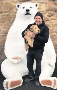  ?? Julie Colvin ?? ●● Alan with a ‘polar bear’ and a dog