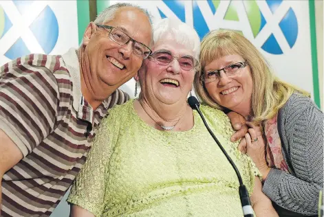  ?? DON HEALY ?? Mary Wernicke, centre, of Neville, her son Fred Wernicke, left, and daughter Julie Welk are all smiles at a Sask Lotteries news conference on Thursday. Mary’s winning ticket is worth $60 million, which is the province’s largest jackpot.