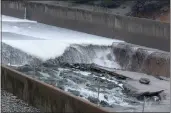  ?? BILL HUSA — THE CHICO ENTERPRISE-RECORD FILE ?? Damaged concrete on Lake Oroville Dam's spillway in Oroville.