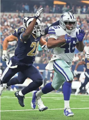  ??  ?? Cowboys running back Alfred Morris, running against Rams cornerback Kayvon Webster, likely will see his playing time increase. MATTHEW EMMONS, USA TODAY SPORTS