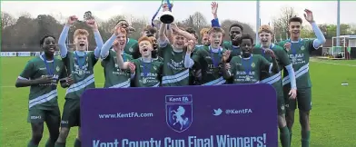  ??  ?? Ashford United under-15s celebrate their Kent CountyCup final win over Ebbsfleet at Faversham’s Salters Lane ground on Sunday. Below, goalmouth action from the game