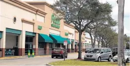  ?? CARLINE JEAN/SOUTH FLORIDA SUN SENTINEL ?? The Plaza at Delray stays busy in Delray Beach on Jan. 2, 2022. A Delray Beach developer is looking to overhaul the shopping complex at Linton and Federal Highway by adding multiple four-story buildings, and putting apartments on top of the existing Publix in the plaza.