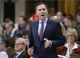  ?? ADRIAN WYLD, THE CANADIAN PRESS ?? Finance Minister Bill Morneau is expected to tell G20 finance ministers in Washington this week that Trump’s executive order runs contrary to Canada’s trading interests.