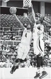  ?? Eric Christian Smith ?? Fort Bend Marshall’s D.J. Day, left, gets the inside track to the basket as Beaumont Central’s John Walker defends Saturday at the Merrell Center.