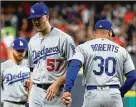  ?? EZRA SHAW/ GETTY IMAGES ?? Dodgers pitcher Alex Wood never wants to leave a game, but he’s OK with the Dodgers’ approach because it works.