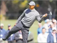  ?? Mike Carlson / Associated Press ?? Tiger Woods reacts after missing a putt on the third hole during the first round of the Valspar Championsh­ip Thursday in Palm Harbor, Fla.