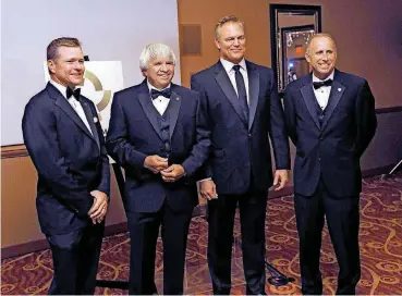  ?? [PHOTO BY NATE BILLINGS, THE OKLAHOMAN] ?? Joe Dial, far right, poses for a photo during a reception for the Oklahoma Sports Hall of Fame induction ceremony on Aug. 1. Dial was inducted into the National Federation of State High School Associatio­ns Hall of Fame earlier this month.