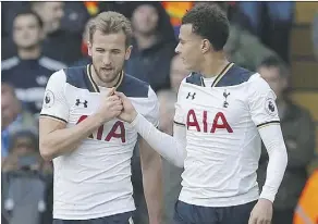  ?? THE CANADIAN PRESS ?? Hotspur’s Harry Kane, left, and Dele Alli drew the ire of some soccer fans by celebratin­g a goal against Everton earlier this month with an elaborate handshake that featured at least 10 moves.