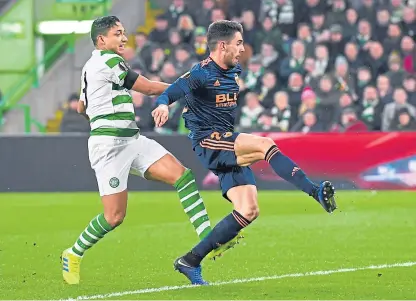  ?? Pictures: SNS/PA. ?? Valencia’s Denis Cheryshev, top, scores the La Liga side’s first goal while Ruben Sobrino beats Emilio Izaguirre to add the second crucial strike early in the second half.