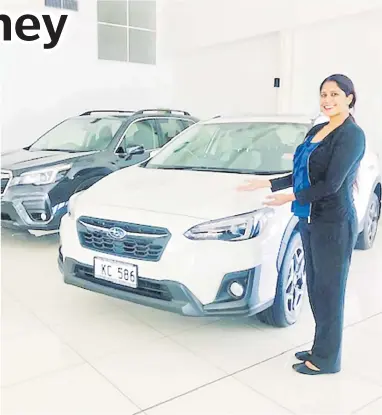  ?? Picture: SUPPLIED ?? Sales consultant Priya Prasad shows some pre-used Subarus available at their Vatuwaqa showroom.