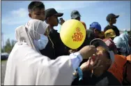  ?? (AP/Riska Munawarah) ?? A medical worker gives vaccine to a boy during a polio immunizati­on campaign Monday at Sigli Town Square in Pidie, Aceh province, Indonesia.