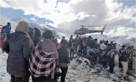  ?? Nepal Army/AFP/Get ty Images ?? Nepalese military helicopter­s have been involved in rescue operations following a series of blizzards and avalanches.