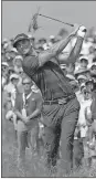  ?? David J. Phillip / AP ?? Dustin Johnson hits out of the fescue on the 17th hole during the first round of the U.S. Open at Erin Hills.