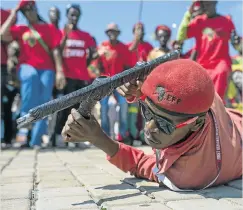  ?? Picture: IHSAAN HAFFEJEE ?? WAR GAMES: EFF supporters demonstrat­e near the Constituti­onal Court during the Nkandla hearing