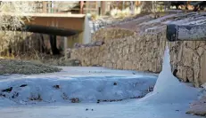  ?? LUIS SÁNCHEZ SATURNO/THE NEW MEXICAN ?? Ice encrusts a portion of the Santa Fe River on Wednesday. Water scheduled to be released from a regional reservoir will boost the river’s flow a hundredfol­d to an unusually high level for a short time this month.