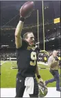  ?? Jonathan Bachman / Getty Images ?? The Saints’ Drew Brees celebrates after Sunday’s win over the Panthers.