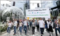  ??  ?? Amazon workers walk out for the Global Climate Strike.