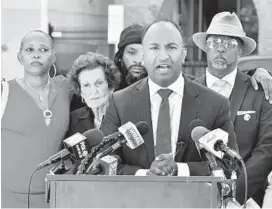  ?? AMY DAVIS/BALTIMORE SUN ?? Mayoral candidate Thiru Vignarajah calls for action on surveillan­ce to help fight crime. He was joined, from left, by Victory Swift, whose son was murdered in 2017; former Councilwom­an Rikki Spector, and community leaders Archie Williams and Marvin “Doc” Cheatham.