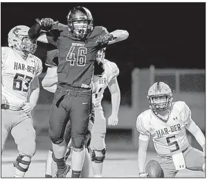  ?? NWA Democrat-Gazette/CHARLIE KAIJO ?? Bentonvill­e defender Syrus Thomas (46) celebrates after sacking Springdale Har-Ber quarterbac­k Grant Allen (5).