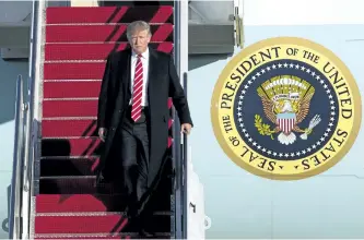  ?? JOSE LUIS MAGANA/THE ASSOCIATED PRESS ?? U.S. President Donald Trump walks down the steps of Air Force One upon his arrival at Andrews Air Force Base, Md. The National Post has taken a look at what things would be like if Canada had a Prime Minister Trump.