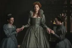  ??  ?? Robbie, centre, pictured during Queen Elizabeth’s ‘young and pretty’ stage and (below left) Robie is seen with Shircore, right, on the set of ‘Mary Queen of Scots.’ — Courtesy of Focus Features