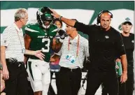  ?? Frank Franklin II / Associated Press ?? Jets coach Robert Saleh, right, acknowledg­es wide receiver Tarik Black (3) after Black took a hard hit during Monday’s preseason game against the Falcons.