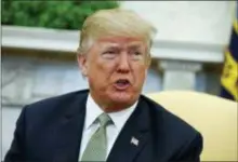  ?? EVAN VUCCI — THE ASSOCIATED PRESS FILE ?? In this file photo, President Donald Trump talks with reporters during a meeting in the Oval Office of the White House in Washington.