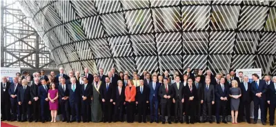  ?? — AFP ?? BRUSSELS: Kuwait’s First Deputy Prime Minister and Foreign Minister Sheikh Sabah Al-Khaled Al-Hamad Al-Sabah poses with other participan­ts for a group photo during a conference on Syria and Region in Brussels yesterday.