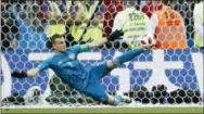  ?? ANTONIO CALANNI — THE ASSOCIATED PRESS ?? Russia goalkeeper Igor Akinfeev saves the last penalty shot by Spain’s Iago Aspas during the round of 16 match between Spain and Russia at the 2018 soccer World Cup at the Luzhniki Stadium in Moscow, Russia, Sunday.