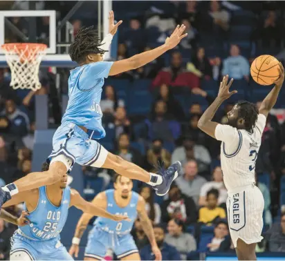  ?? MIKE CAUDILL/FREELANCE PHOTOS ?? Old Dominion guard Chaunce Jenkins (2) leaps in the air to block a pass from Georgia Southern guard Tyren Moore (3) during the first half on Saturday at Chartway Arena in Norfolk.