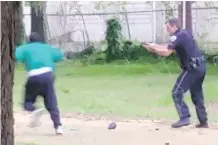  ?? THE ASSOCIATED PRESS ?? In this April 4 video capture, Walter Scott appears to be running away as patrolman Michael Slager shoots in North Charleston, S. C. Slager was charged with murder on Tuesday.