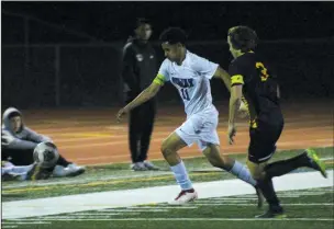  ?? MIKE BUSH/NEWS-SENTINEL ?? Tokay midfielder Brandon Razo (11) and Oak Ridge's Alex Carpignano (3) chase after the soccer ball in Tuesday's Sac-Joaquin Section Division I playoff game.