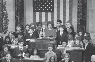  ?? SAUL LOEB / AFP ?? Incoming House Speaker Nancy Pelosi, surrounded by children and grandchild­ren of lawmakers, takes the oath at the closing of the 116th Congress at the US Capitol on Thursday.