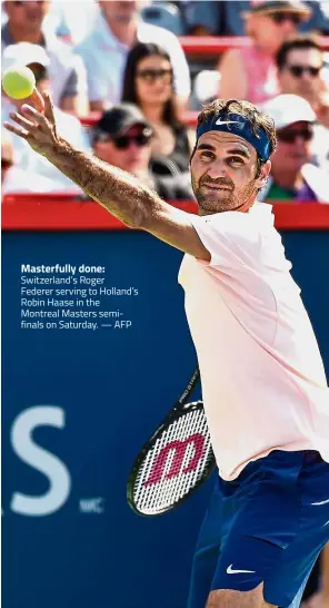  ??  ?? Switzerlan­d’s Roger Federer serving to Holland’s Robin Haase in the Montreal Masters semifinals on Saturday. — AFP Masterfull­y done: