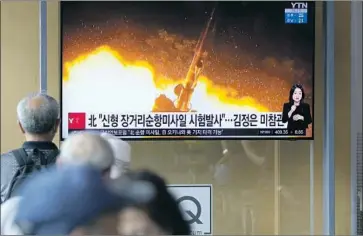  ?? Lee Jin-man Associated Press ?? PEOPLE IN SEOUL watch a news segment Monday on North Korea’s weekend weapons testing. Experts say the North’s rulers are probably moving toward putting their cruise missiles on submarines and other vessels.