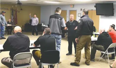  ?? STAFF PHOTOS BY TIM BARBER ?? Members of a crisis Interventi­on Team engage in role-play Friday morning in the Chattanoog­a Police Department’s community room inside the Police Services Center on Amnicola Highway.