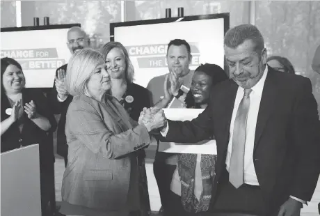  ?? MARTA IWANEK/THE CANADIAN PRESS ?? Ontario NDP Leader Andrea Horwath with Elementary Teachers’ Federation of Ontario president Sam Hammond in Toronto last week. The NDP pledges to hire teachers and education assistants, in part so they can cap kindergart­en classes at 26 kids.