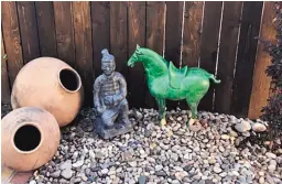 ?? COURTESY OF SAUNDRA POWERS ?? A ceramic, jade-green Tang horse statue had been one of the features Taylor Ranch neighbors admired in the front yard of the Powers home. Earlier this month, some strange horseplay forced her to move it to a safer location.