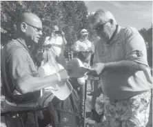  ??  ?? John Daly was in a good mood and signing autographs after his opening-round 65 on Friday.