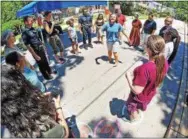  ?? CHRIS BARBER — DIGITAL FIRST MEDIA ?? Guests at Juneteenth and local police take part in a cakewalk, which has roots in African American history.