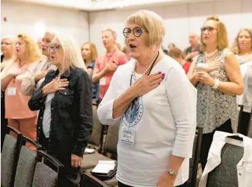  ?? REBECCA S. GRATZ/AP ?? Robbie Adams, of Sarpy County, Neb., recites the Pledge of Allegiance at Neb. Election Integrity Forum.