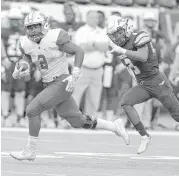  ?? Elizabeth Conley / Houston Chronicle ?? Katy’s Deondrick Glass (2) breaks loose on a run against the Cypress Ranch defense. Glass rushed for 181 yards and two touchdowns.