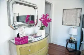  ?? TRIBUNE NEWS SERVICE PHOTO ?? Hot pink packs a powerful color punch in this bedroom.