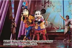  ??  ?? WATAK Mickey Mouse dan rakan sememangny­a mencuit hati pengunjung di HKDL