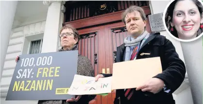  ??  ?? > Richard Ratcliffe poses for the media before attempting to deliver a collection of letters and posters calling for the release of his wife, jailed UK-Iranian Nazanin Zaghari-Ratcliffe, inset, to the Iranian Embassy yesterday