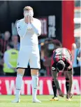  ??  ?? Bitter blow: Swansea’s Alfie Mawson is distraught after Ryan Fraser’s goal