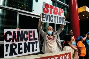  ?? AP PHOTO BY BRITTAINY NEWMAN ?? In this Aug. 4 file photo, housing advocates protest on the eviction moratorium in New York. The Supreme Court is allowing evictions to resume across the United States, blocking the Biden administra­tion from enforcing a temporary ban that was put in place because of the coronaviru­s pandemic. Roughly 3.5 million people in the United States said they faced eviction in the next two months, according to Census Bureau data from early August.