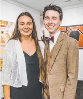  ??  ?? Beata Batorowicz and Brodie Taylor view the new indigenous art collection on loan to USQ..