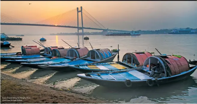  ??  ?? Boats moored along the Hooghly River, which runs through Kolkata